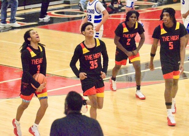 Trenton High players Juan Sanchez, 3, Jharris Genao Ramos, 35,...