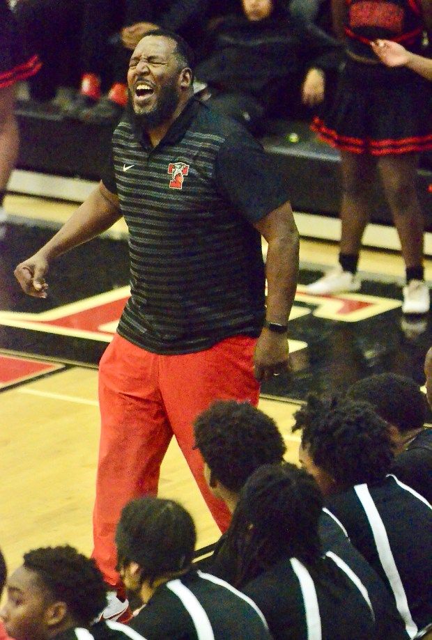 Trenton High coach Darryl Young reacts to a play against...
