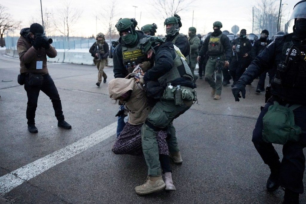 Federal agents detain a demonstrator, in front of the Bishop Henry Whipple Federal Building, during a protest more than a week after an ICE agent fatally shot Renee Nicole Good, in Minneapolis, Minnesota, U.S., January 17, 2026.