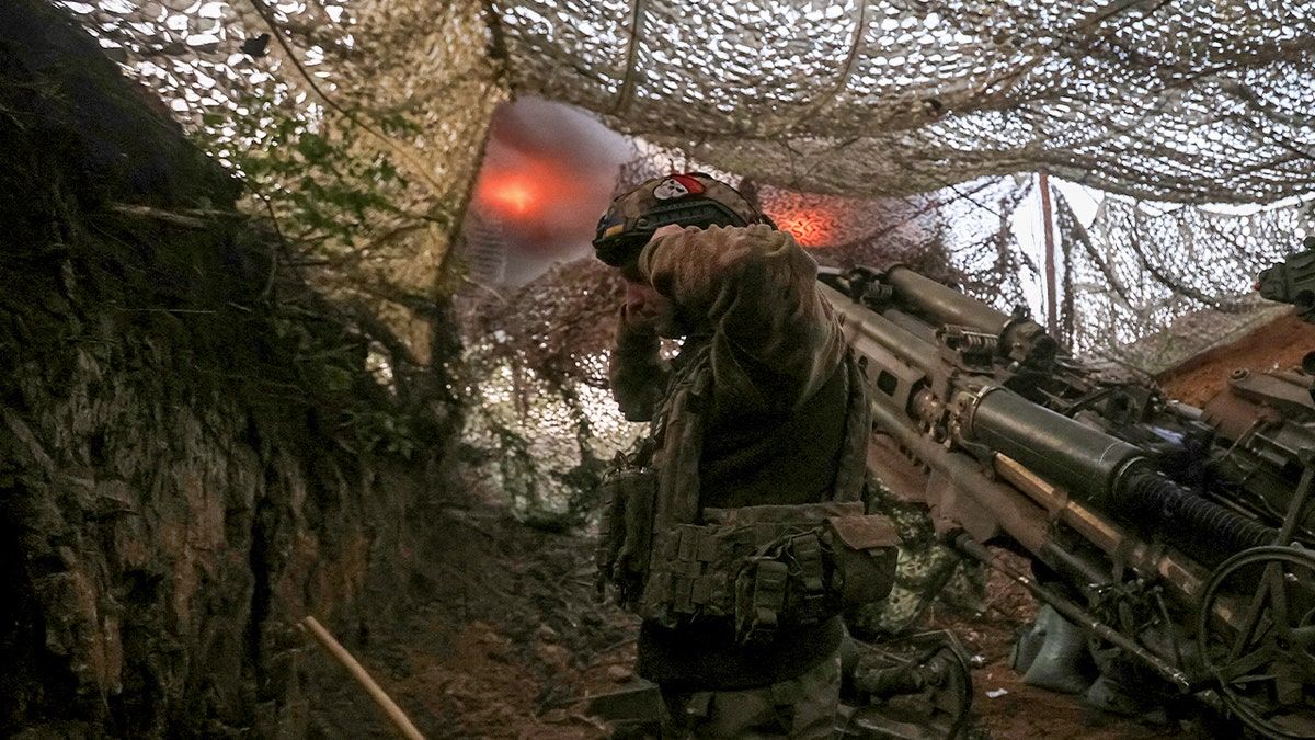 A serviceman of the 148th Separate Artillery Zhytomyr Brigade of the Armed Forces of Ukraine, fires a M777 Howitzer towards Russian troops at a position on the front line, amid Russia's attack on Ukraine.